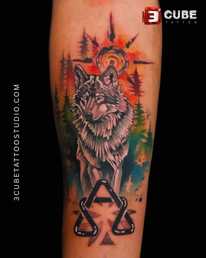 Colorful wolf tattoo with nature elements done by skilled tattoo artist at 3Cube Tattoo Studio Kolkata.