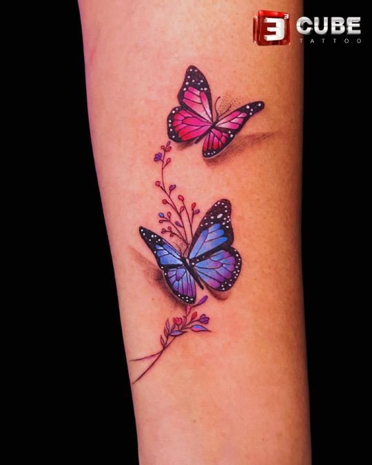 3D butterfly couple tattoo by 3cube tattoo studio in Kolkata, featuring vibrant pink and blue butterflies symbolizing love and togetherness.