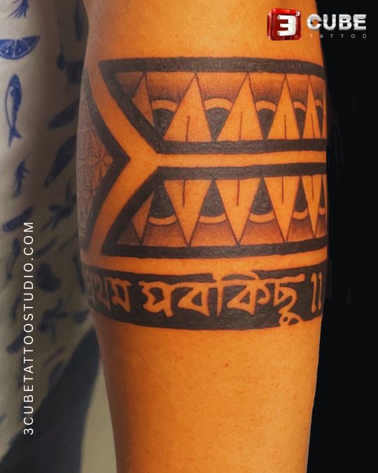 A bold tribal-style geometric band tattoo with unique patterns, perfect for the forearm or bicep. This design represents strength, tradition, and individuality.