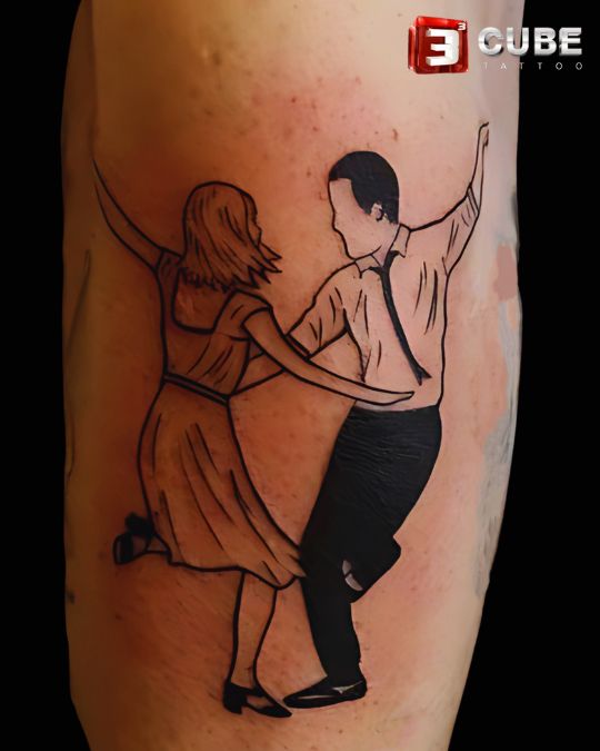 dancing couple outline tattoo in black ink by 3cube tattoo studio kolkata, celebrating love and togetherness for couples.