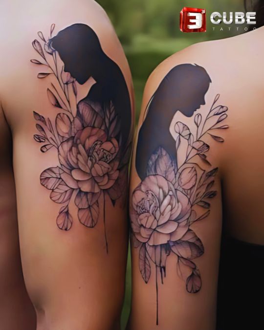 Portrait silhouette couple tattoo with floral artwork at 3cube tattoo studio Kolkata, expressing unity and romance through artistic tattoos for couples.
