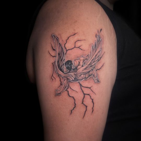 A clean and detailed fine line tattoo on bicep created by 3 Cube Tattoo artist.