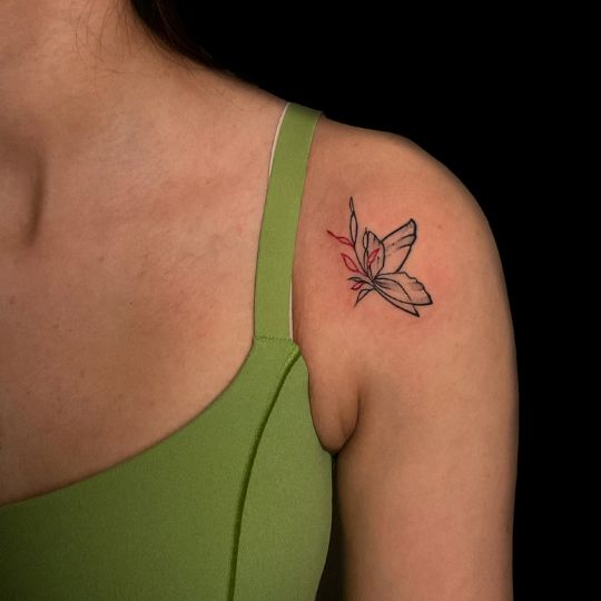 Minimal and elegant micro tattoo on ankle done by professional tattooists at 3 Cube Tattoo.