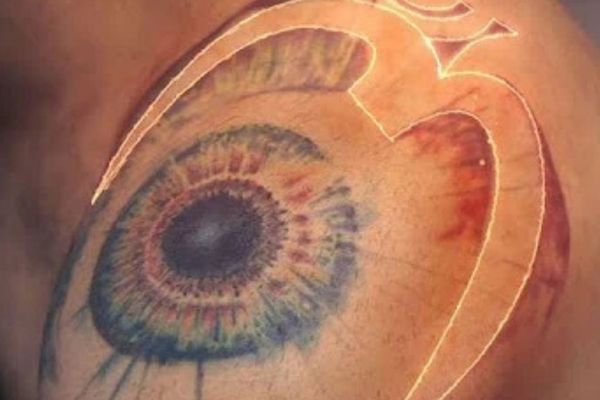 spiritual tattoos of Virat Kohli of OM symbol wriiten in Hindi and covers his shoulder